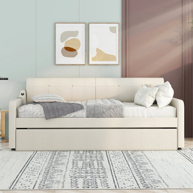Lit de jour beige avec lit gigogne amovible et fonctionnalité de chargement