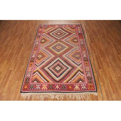 Tapis kilim en laine rose à motif géométrique 5 x 9