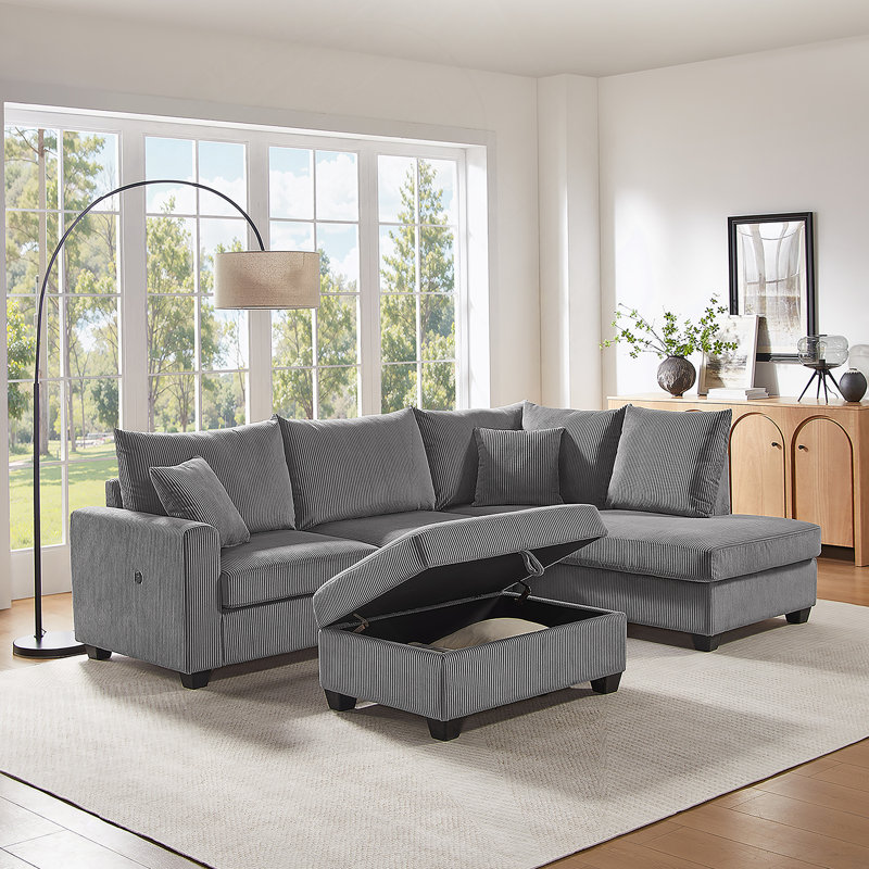 Canapé modulaire confortable avec méridienne orientée vers la droite, ports de charge, repose-pieds avec rangement et coussins pour se détendre et recevoir à la maison