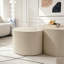 Table basse ronde en forme d'olive avec un relief artisanal-1608831306