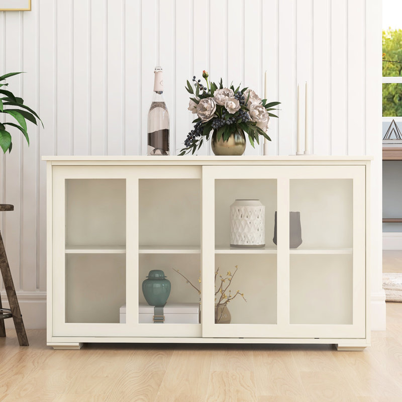 White Kitchen Storage Cabinet With Glass Door. Solid Construction For Reliable Performance. 2 Sliding Doors And Adjustable Shelf Maximized Storage. Painting. Non-Slip Base To Keep In Place E1 Grade