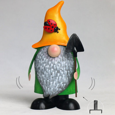 Figurine de jardin gonflable en métal tenant une pelle