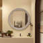 Miroir mural rond avec cadre sculpté