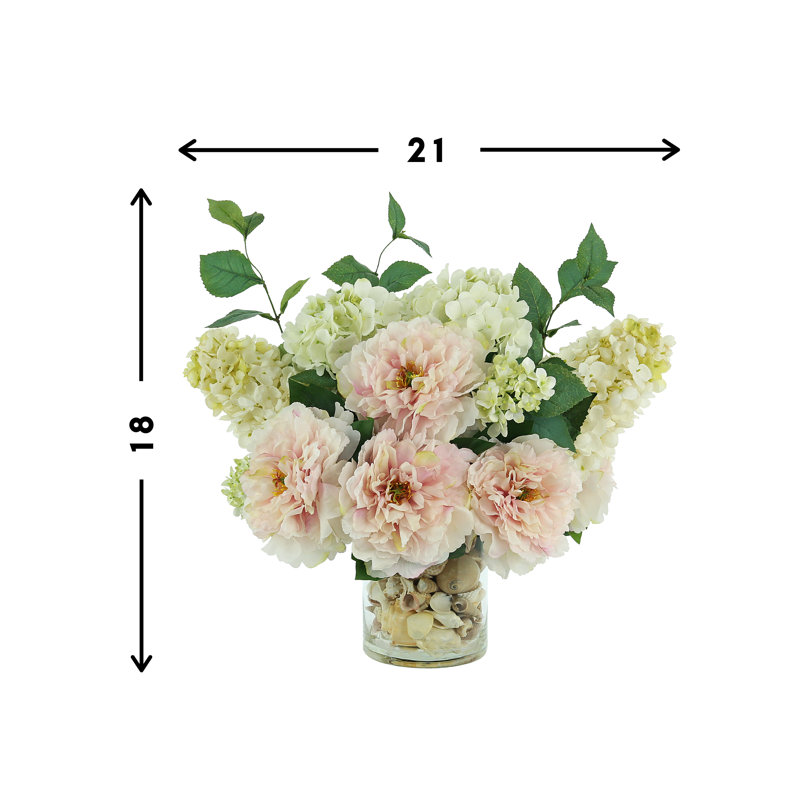 Peony and Hydrangea Arrangement in a Clear Glass Pot with Seashell