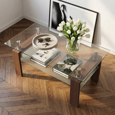 Table basse contemporaine en verre avec cadre en fer et espace de rangement double couche