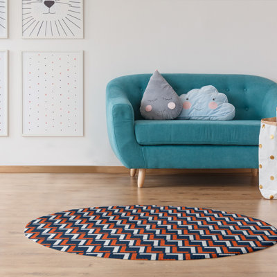 Tapis rond à motif géométrique orange / bleu