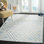 Tapis bleu / ivoire en laine touffeté à la main à motif géométrique Krystyna