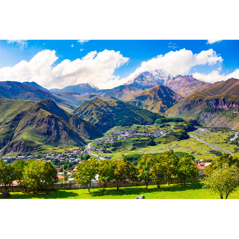 Mount Kazbek 5033 Meters And Gergeti Trinity Church Tsminda Sameba Holy Trinity Church From The Stepantsminda Kazbegi Village In Georgia - Wrapped Canvas Print