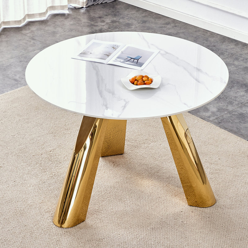 Table de salle à manger ronde avec trois pieds en métal robustes