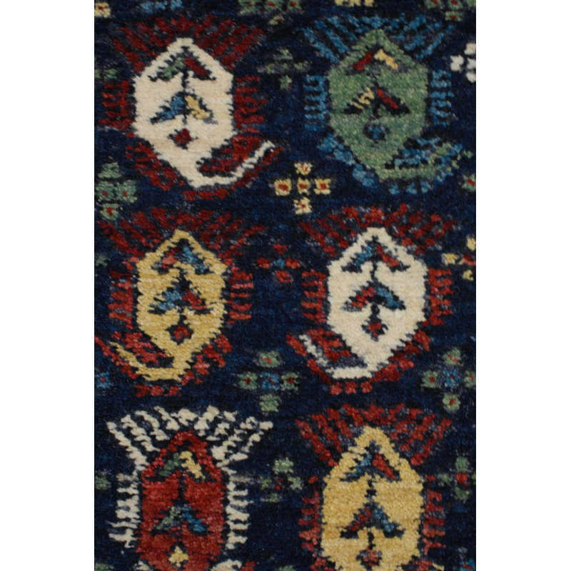 Seychour Wool Oriental Area Rug in Green/Red