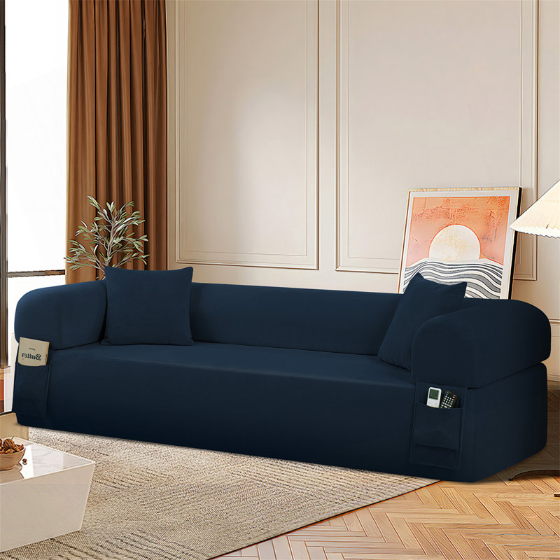 Canapé Spring avec ressorts ensachés, mousse haute densité, poches de rangement et coussins assortis pour un confort et une fonctionnalité ultimes.
