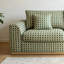 Canapé vert au design crème de style français