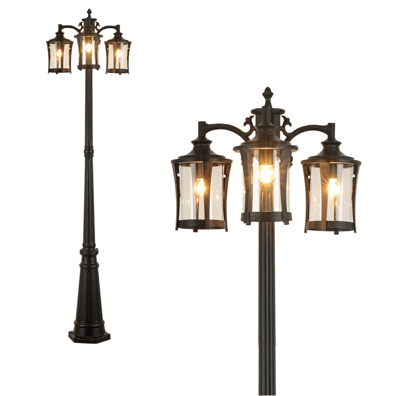 Lampadaire d'extérieur 3 lumières avec abat-jour en verre transparent Dusk to Dawn, structure en métal noir mat