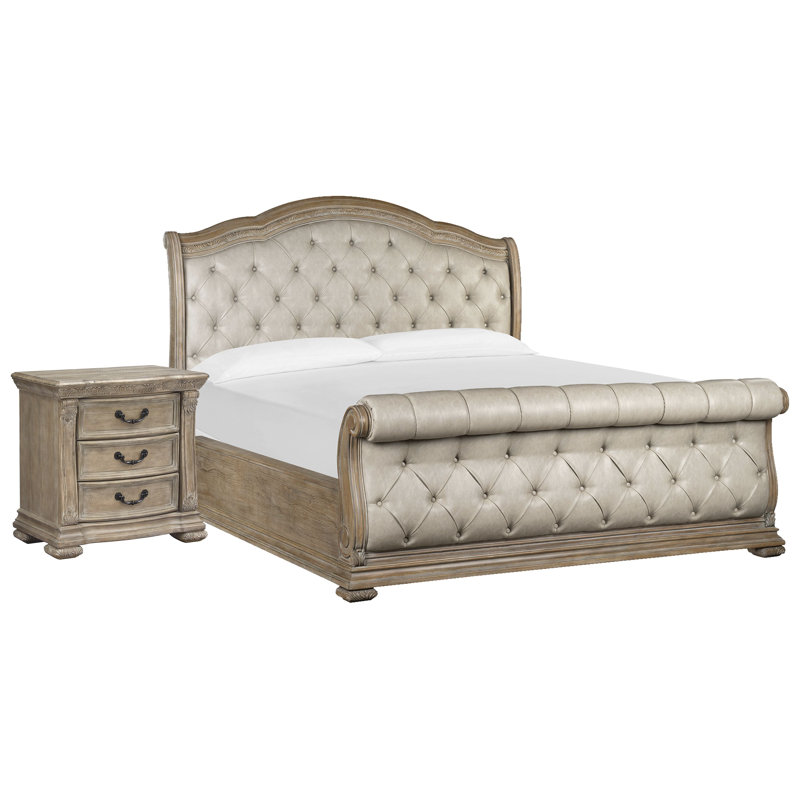 Grand lit-bateau tapissier avec table de chevet