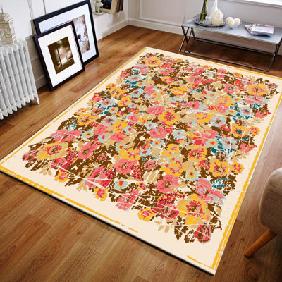 Tapis floral tissé à la machine Virgouda en jute rose / jaune / bleu / brun