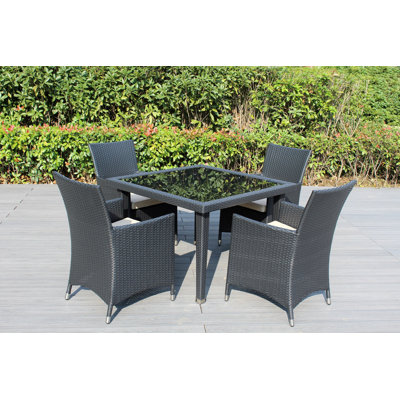 Lumini 4 - Person Wicker Patio Dining Set with Square Table , Cushions Included