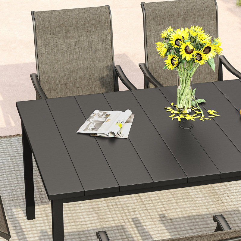 Naasir 6 - Person Patio Dining Set with Rectangular Table, Black Table/Brown Chair