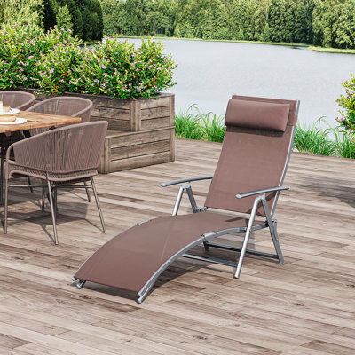 Chaise longue d'extérieur noire pliable en trois, portable et réglable à 7 positions avec coussin Gloria pour le camping et les bains de soleil à la plage ou près de la piscine
