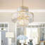 Lustre en cristal doré 12 lumières de luxe à 4 niveaux de 20 po, cadre suspendu, éclairage de plafond élégant pour le salon, la salle à manger et la chambre à coucher
