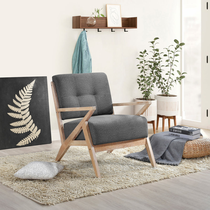 Chaise d'appoint moderne à dossier capitonné avec revêtement gris foncé et finition antique, structure en bois d'hévéa massif, design unique pour des espaces de vie élégants
