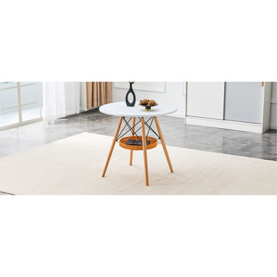 31.5-inch diameter circular dining table, white MDF vacuum formed tabletop,  wood legs, with suspended woven storage basket structure. A casual coffee table suitable for 2-4 people.