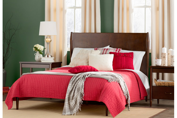 large bed with red bedding