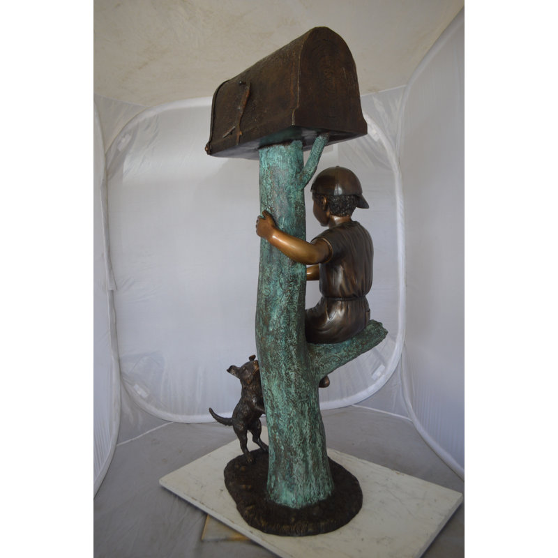 Boy Sitting on a Tree with Mailbox Bronze Statue -  Size: 22"L x 23"W x 49"H. 