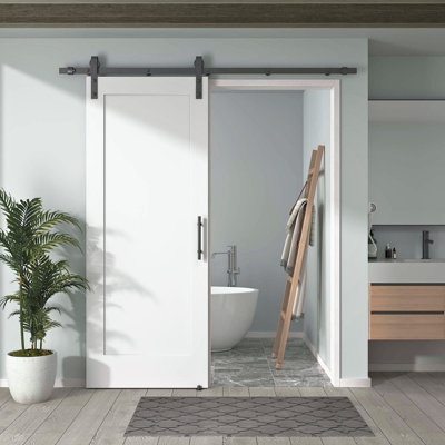 DOOR HARBOR 24in x 80in Pre-Assembled Sliding Barn Door with 4.5ft ALL-IN-ONE Black Hardware Kit, 1-Panel Shaker Design, Solid Core, White Primed, with One-Piece Track, Includes Handle and Lock