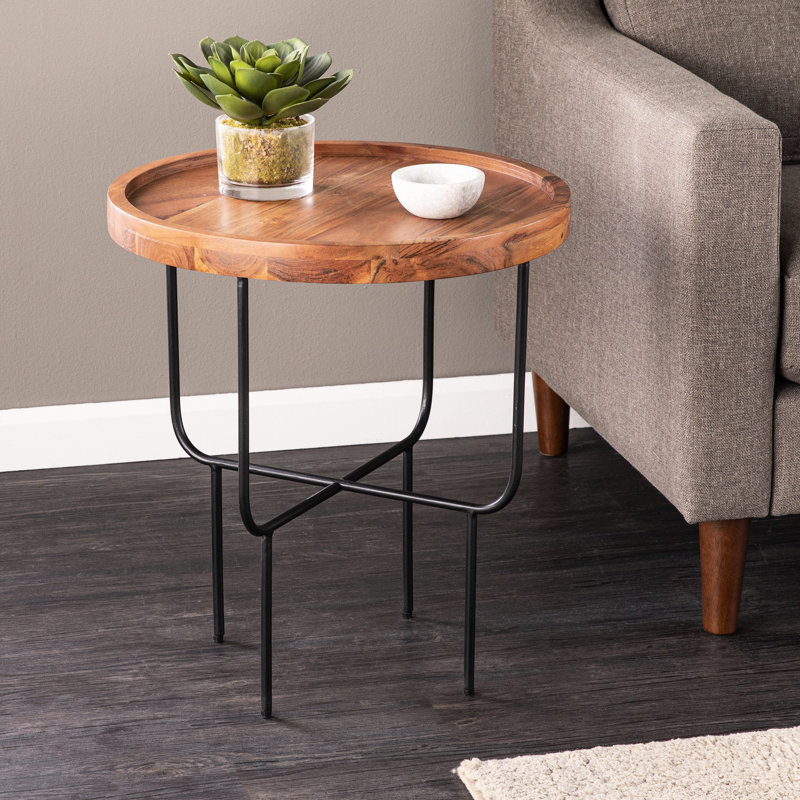 Table de bout ronde avec un plateau en bois massif et une élégante base moderne en fer pour le salon