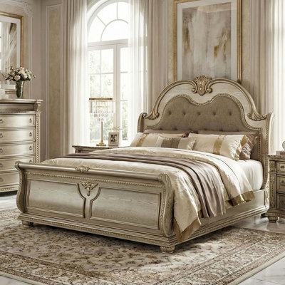Traditional Sleigh Bed with Tufted Upholstery and Elegant Carvings