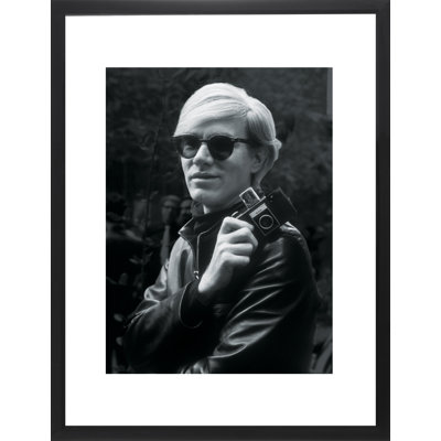 Andy Warhol in His Leather Jacket Holding His Camera 1 Piece Wall Art