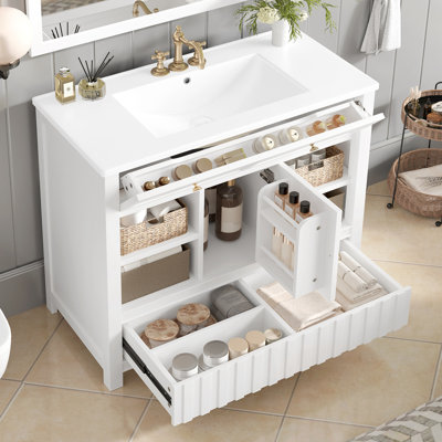 Meuble-lavabo de salle de bain avec lavabo, tiroirs et tablettes de rangement ouvertes