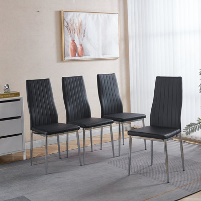 Set Of Four Comfortable Dining Chairs With Chrome - Style Legs And Black - Like Seats For A Modern Dining Experience