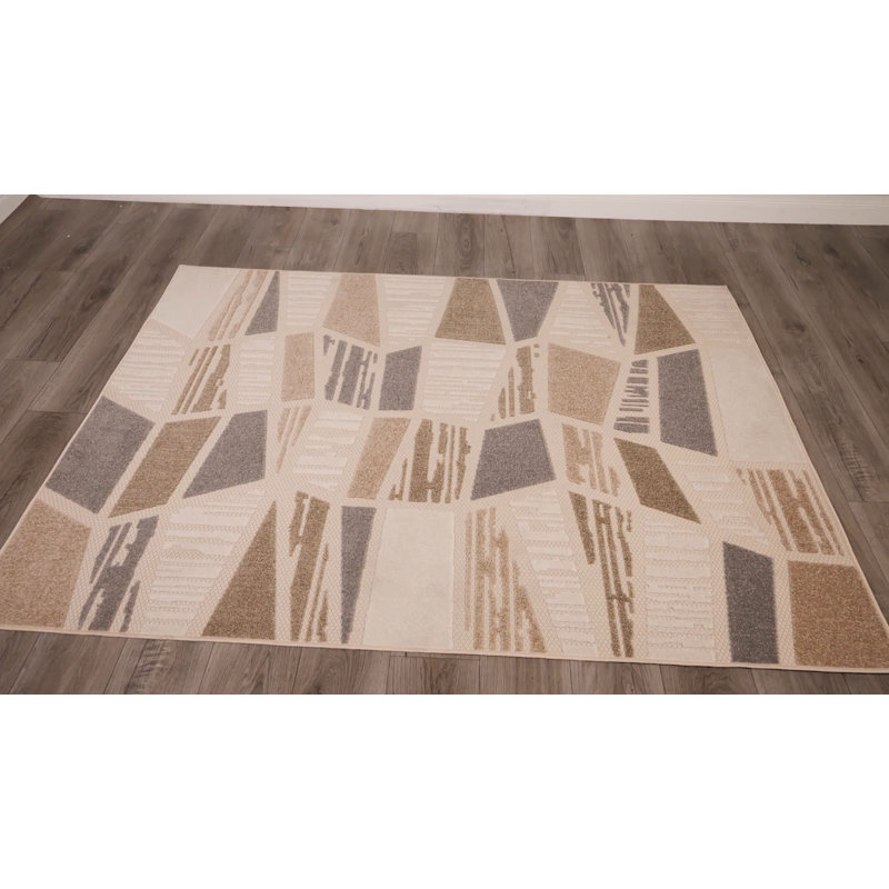 Ivory and Taupe Geometric 5' x 7' Synthetic Area Rug