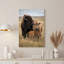 Art sur toile, grand bison brun adulte et veau debout dans de hautes herbes sèches-132730305