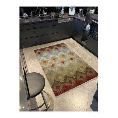 Tapis crème beige à motif géométrique à motif géométrique et franges