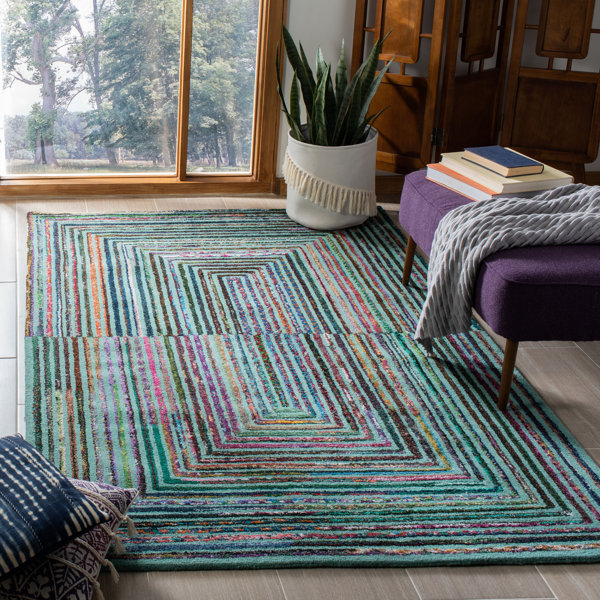 https://assets.wfcdn.com/im/33316591/resize-h600-w600%5Ecompr-r85/8439/84394561/Handmade+Wool+Rug.jpg