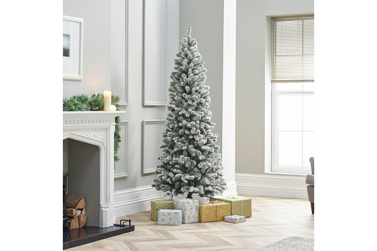 undecorated snowy frosted artificial christmas tree