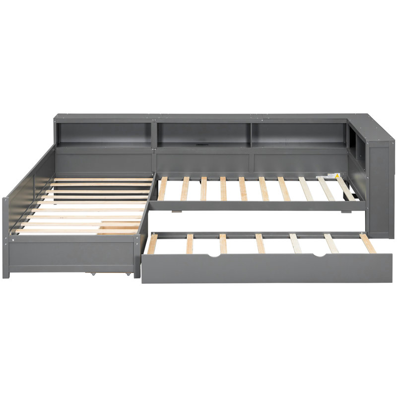 Lit plateforme simple en L gris avec lit gigogne, tiroir et 5 tablettes de rangement, confortable pour plusieurs personnes