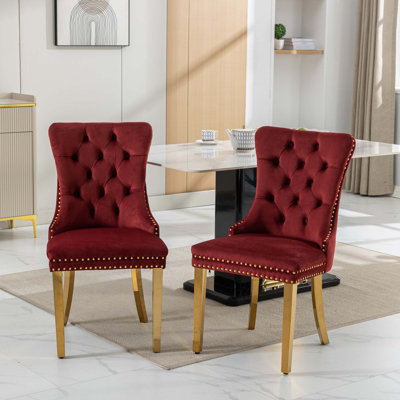 Chaise rembourrée capitonnée en velours de bois massif avec pieds en acier inoxydable doré