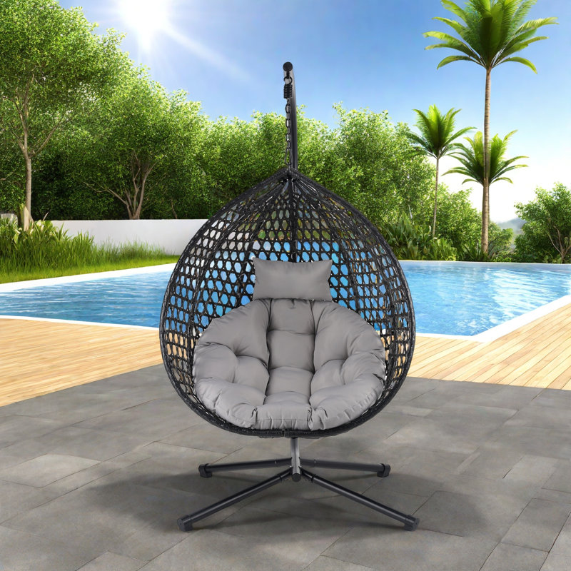 Fauteuil à œufs suspendu polyvalent avec motif en rotin évidé Pe, base en fer, appui-tête et coussin