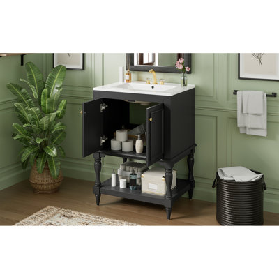 Meuble-lavabo de 61 cm avec lavabo en céramique brillante, ornement élégant, tablette ouverte pour les serviettes, compartiment fermé pour effets personnels, pieds travaillés pour un accès rapide et un rangement discret.
