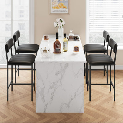 Ensemble de 4 chaises de salle à manger modernes en similicuir noir - Tabourets de bar rembourrés de 95 cm de haut, dossier et repose-pieds, pieds en métal robustes, assise confortable - Parfait pour la cuisine, la salle à manger ou un appartement