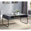 Table basse contemporaine en béton gris et noir avec tablette de rangement inférieure et structure métallique stable pour la maison