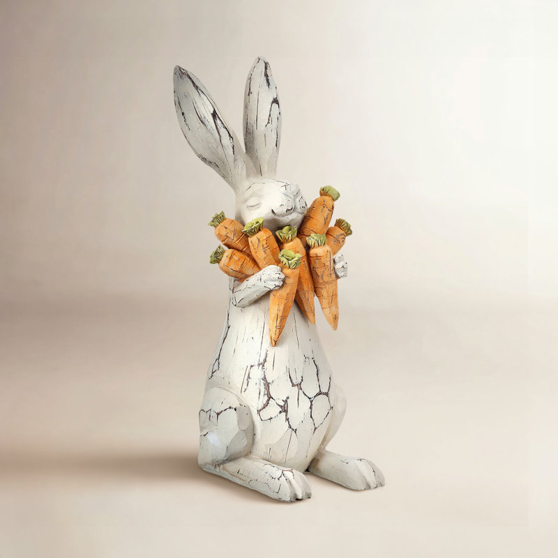 Lapin sculpté en résine avec carottes