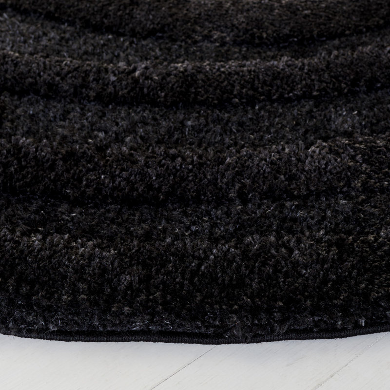 Amberjo Solid Color Machine Made Power Loom Area Rug in Black, Round 5'3"