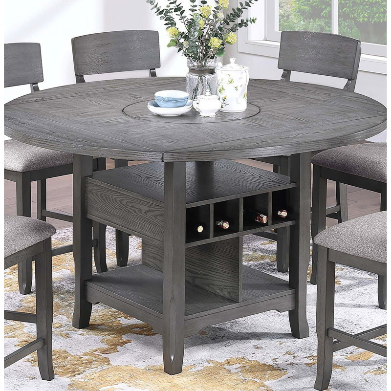 Table transitionnelle grise à hauteur de comptoir avec compartiments ouverts et paresseux intégrés pour les dîners de famille