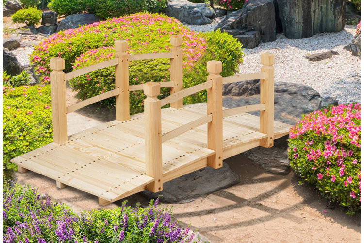 garden landscape with flowers and wood bridge