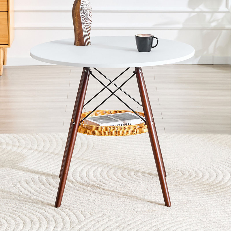 Table de salle à manger circulaire de 31,5 pouces de diamètre, plateau de table en panneau de fibres à densité moyenne blanc, pieds en bois massif de noyer, avec structure de panier de rangement suspendue. Une table basse décontractée pouvant accueillir de 2 à 4 personnes.