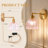 Iron Armed Sconce with Petal-Shaped Glass Shade